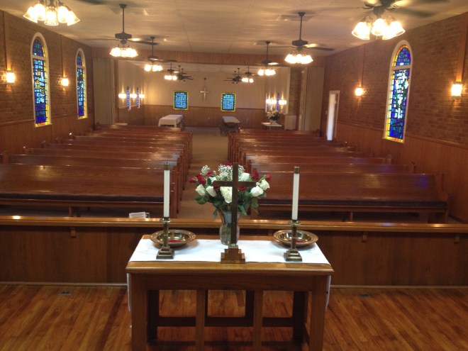View of the redecorated Pine Ridge UMC from the platform.  New items include: paint, ceiling fans, sconces, carpet, and refinishing wood on the platform.