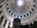 Sunlight streams into the Church of the Holy Sepulcher over the tomb of Jesus.